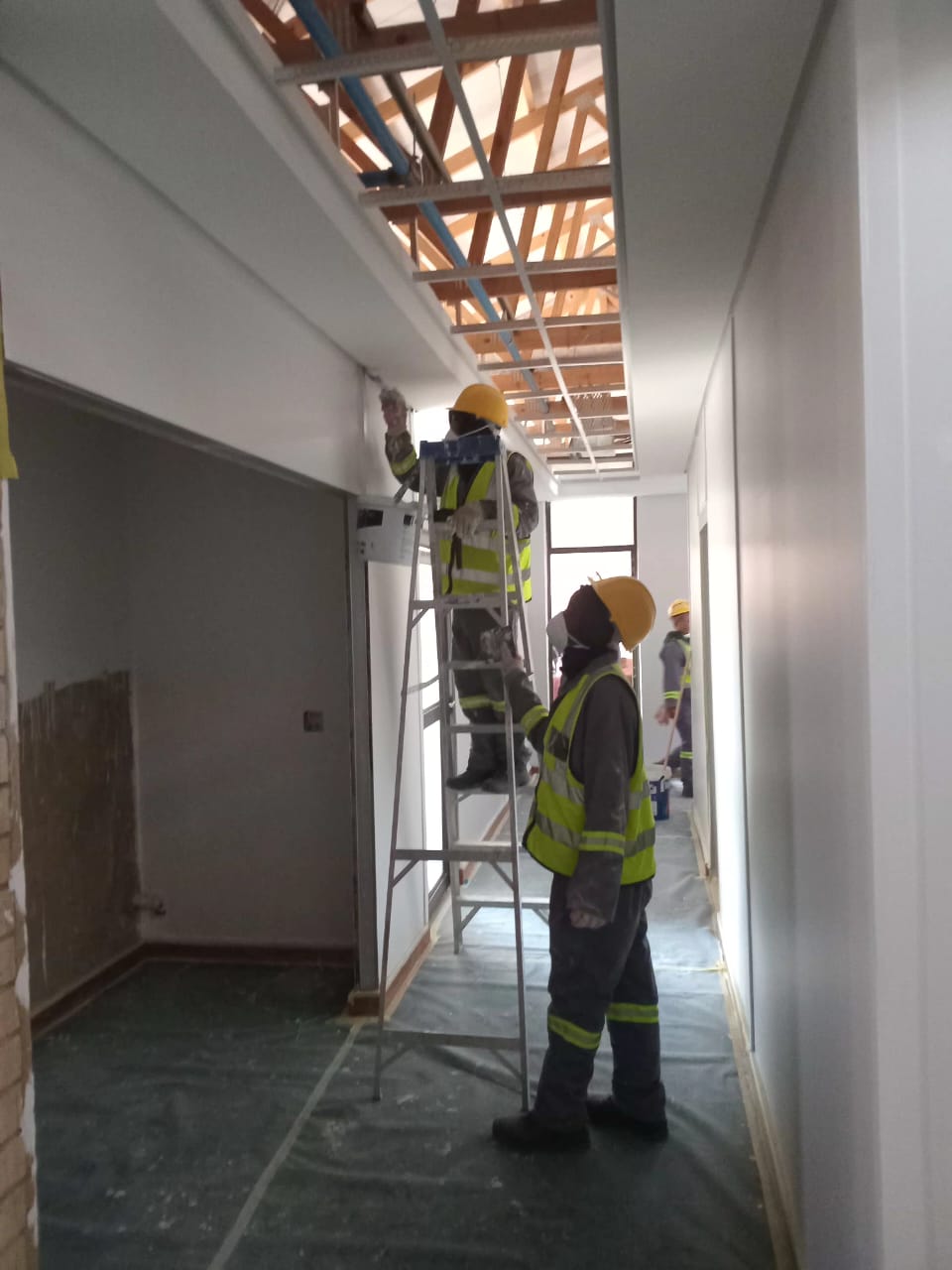HSE personnel supervising work inside a construction environment
