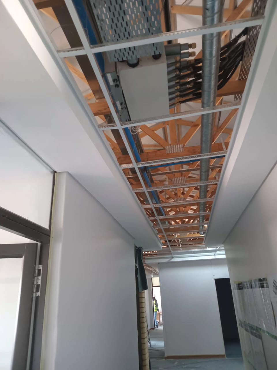 Building services installation and exposed ceiling infrastructure on a construction project